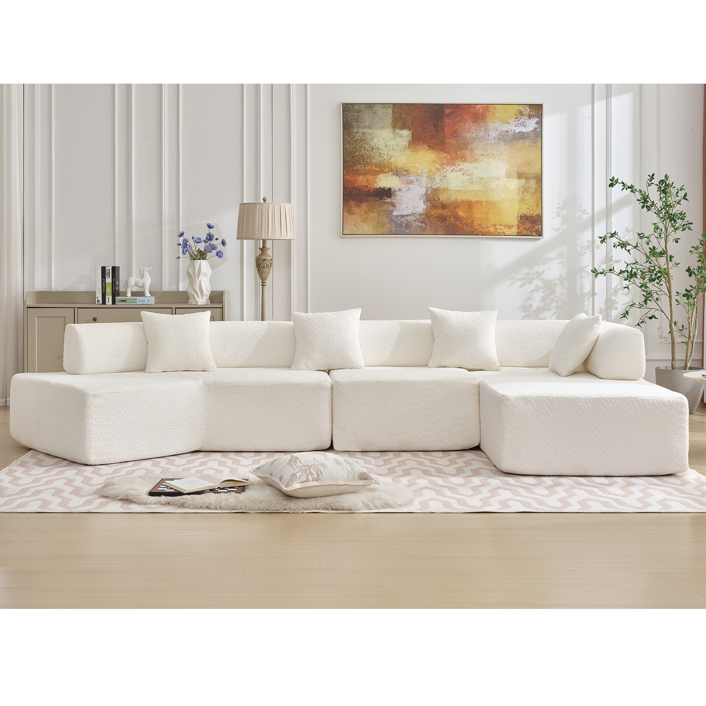 Modern offwhite boucle sectional sofa with plush throw pillows for a cozy living room