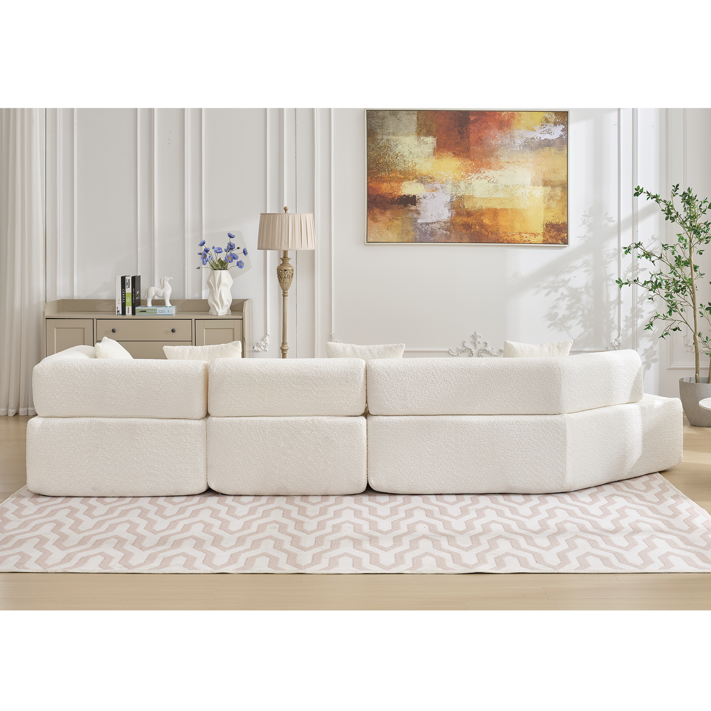 Plush ivory boucle sectional sofa with curved silhouette and modular design