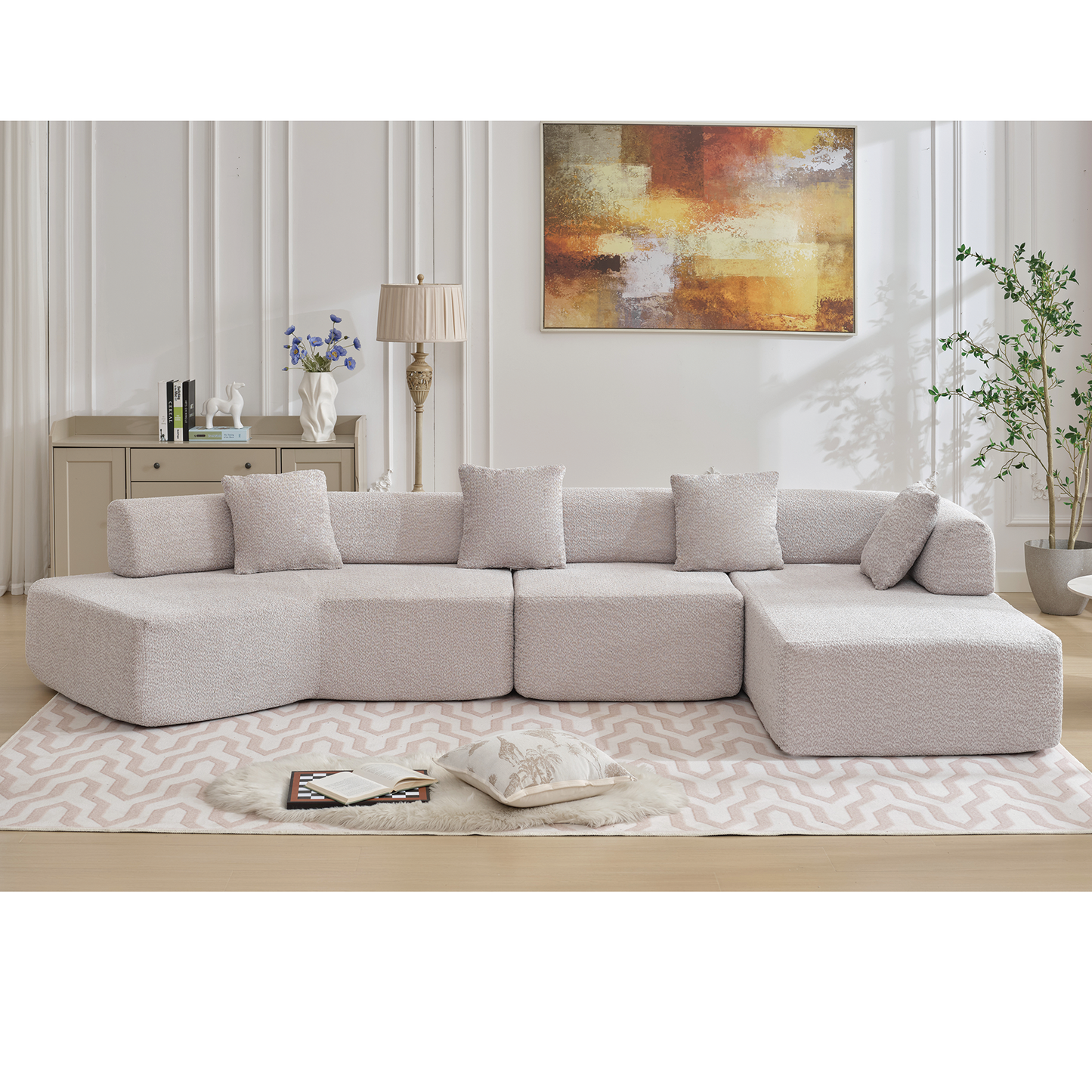 Plush boucle fabric sectional sofa in light beige featuring a chaise lounge and ample seating for a modern living room