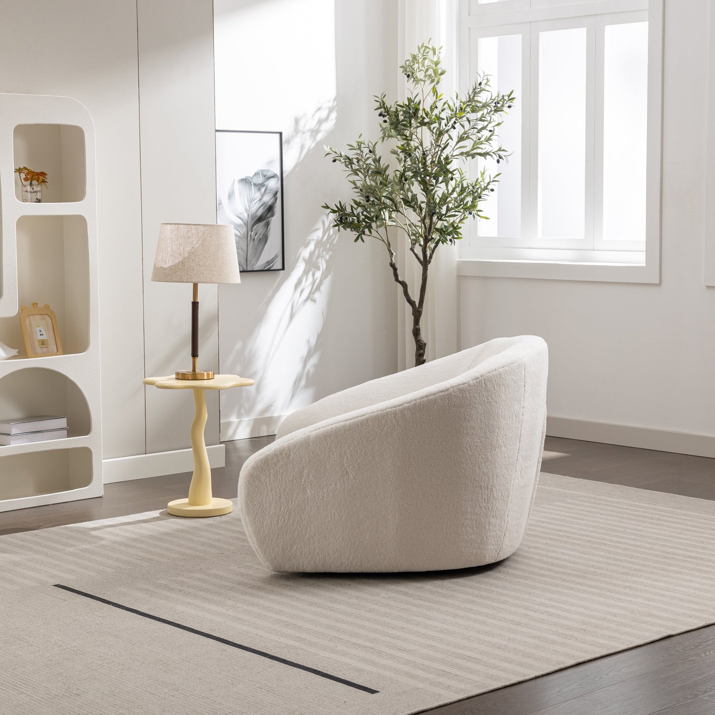 Plush cream boucle accent chair with rounded modern design for living rooms
