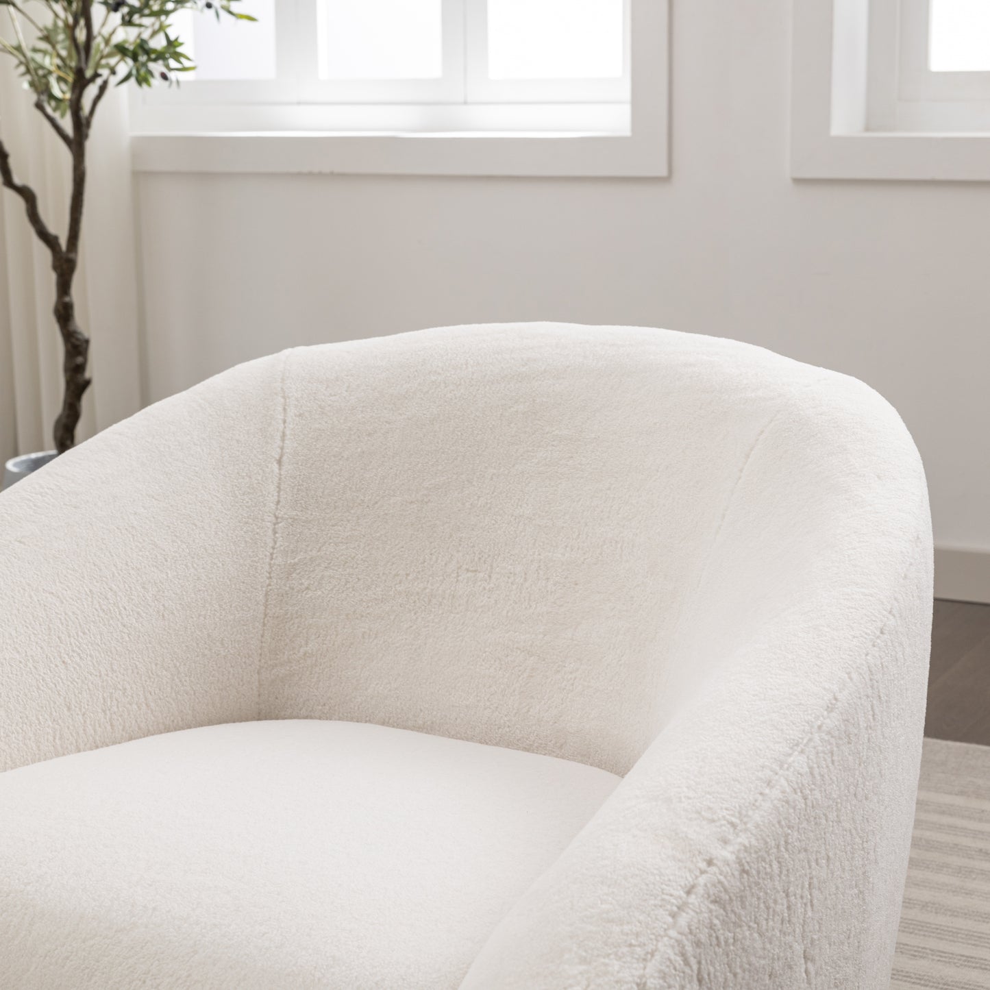 Cozy cream sherpa armchair with a plush textured finish and rounded silhouette