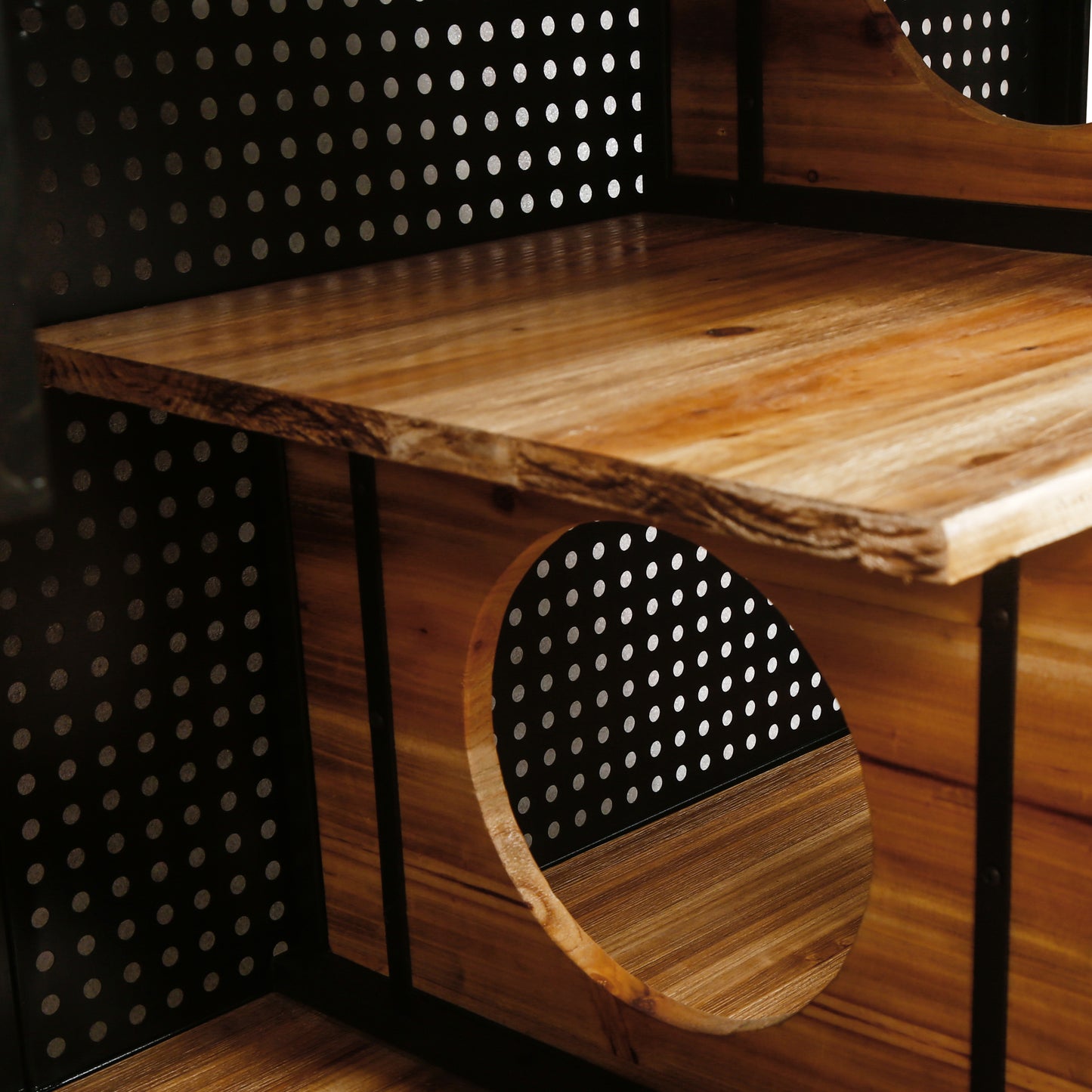 Wooden tiered cat tree with black perforated panels and circular openings