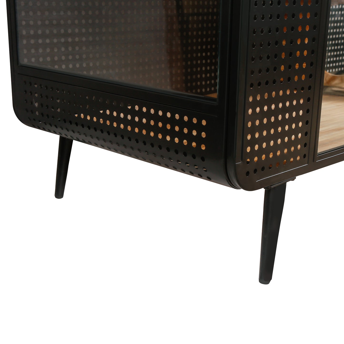 Black metal media cabinet with perforated sides and tapered legs showcasing modern design