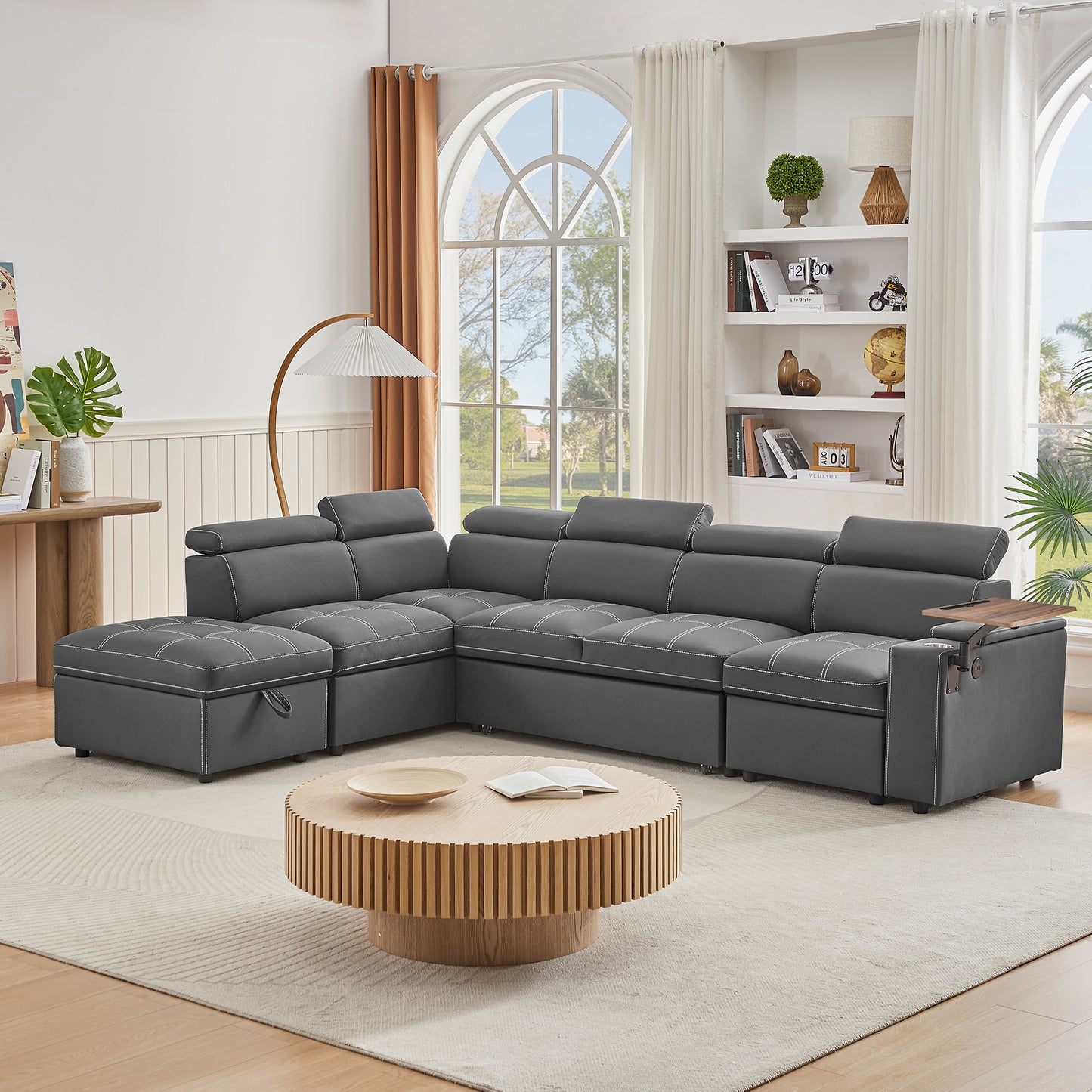 Dark grey sectional sofa with white stitching and builtin storage ideal for modern living rooms