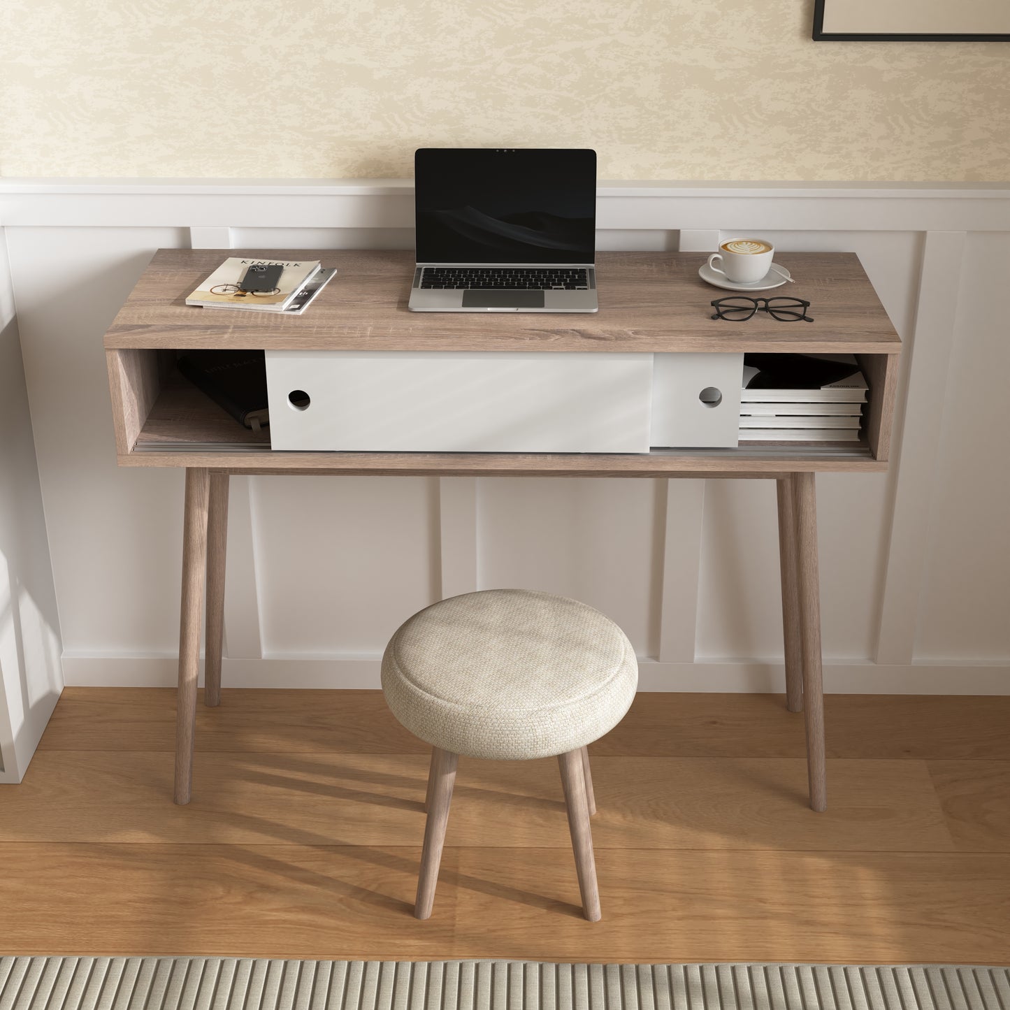 Light oak midcentury modern writing desk with laptop and coffee cup
