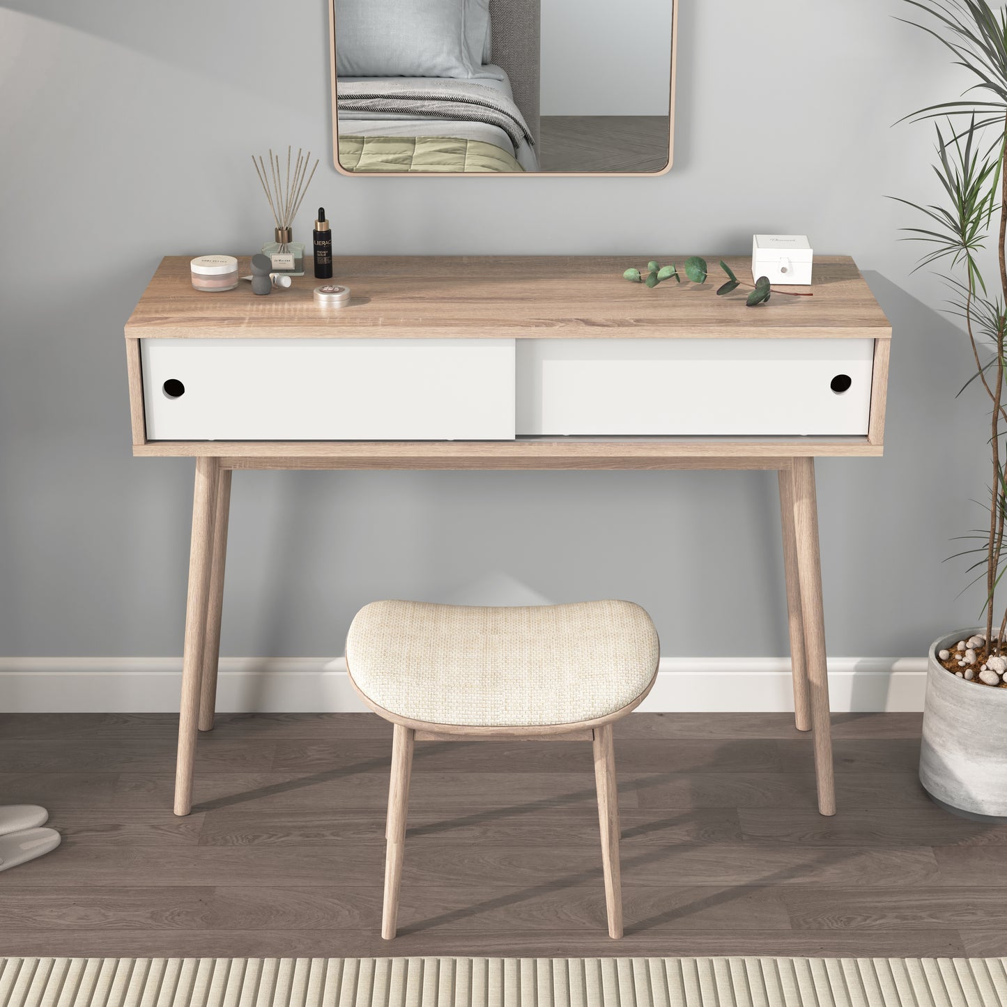 Minimalist light wood vanity table with white sliding drawers and tapered legs