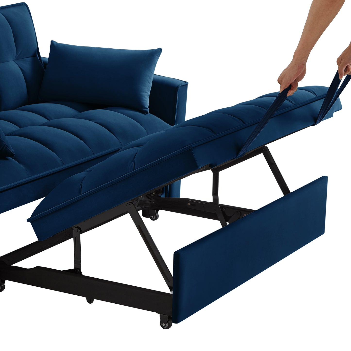 Navy blue velvet sofa bed with tufted cushions being pulled out for conversion