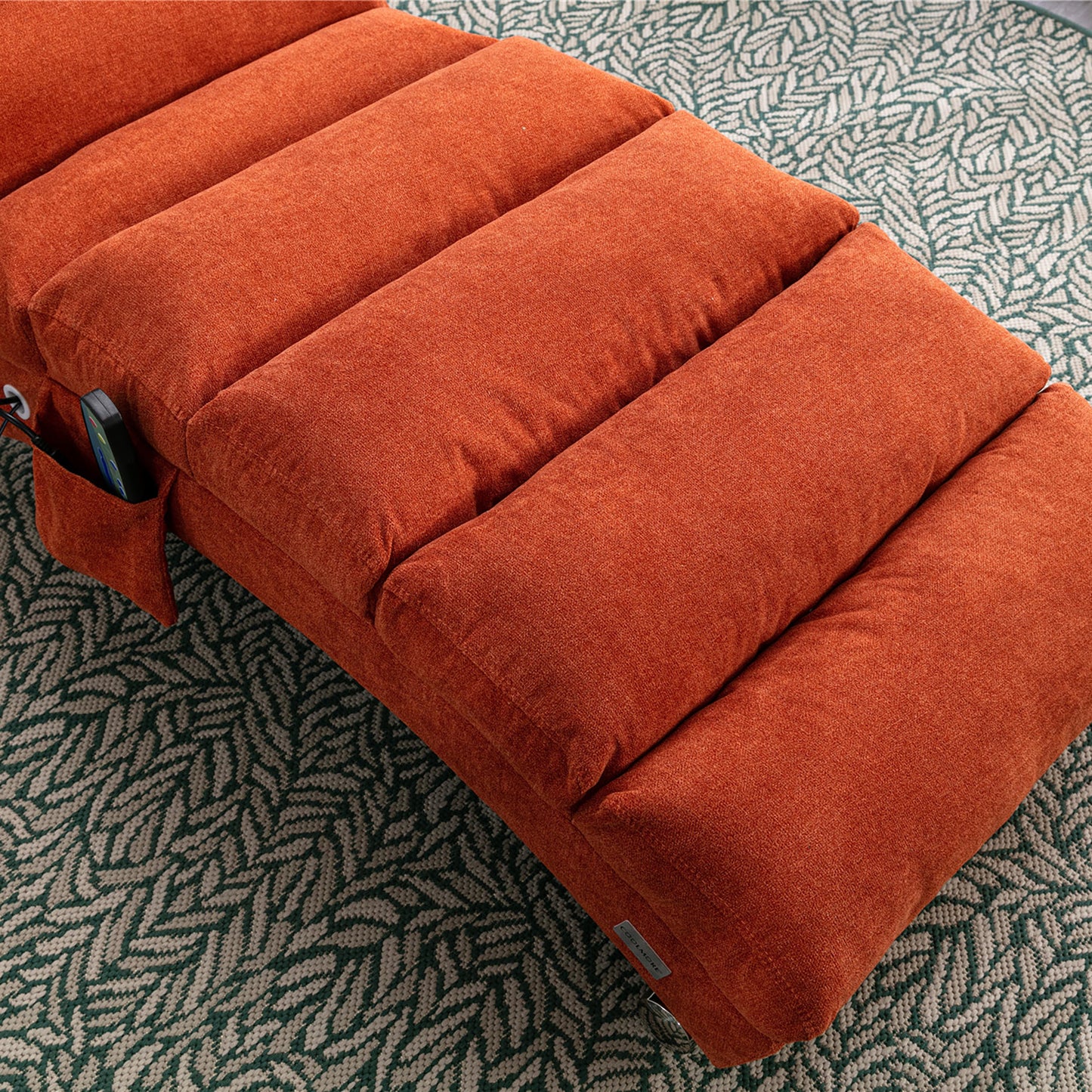 Orange linen floor sofa with plush cushioning and side pocket for remote control