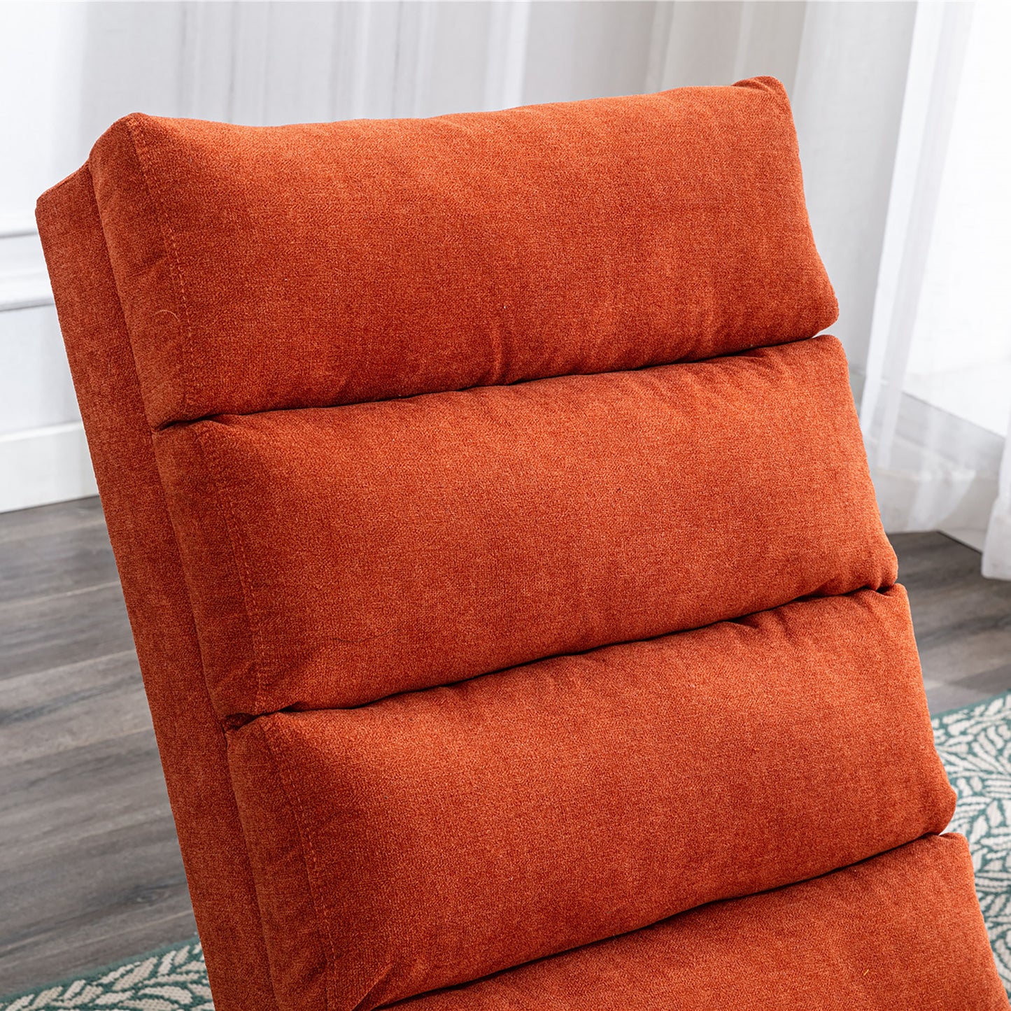 Closeup of an orange textured fabric lounge chair plush and inviting