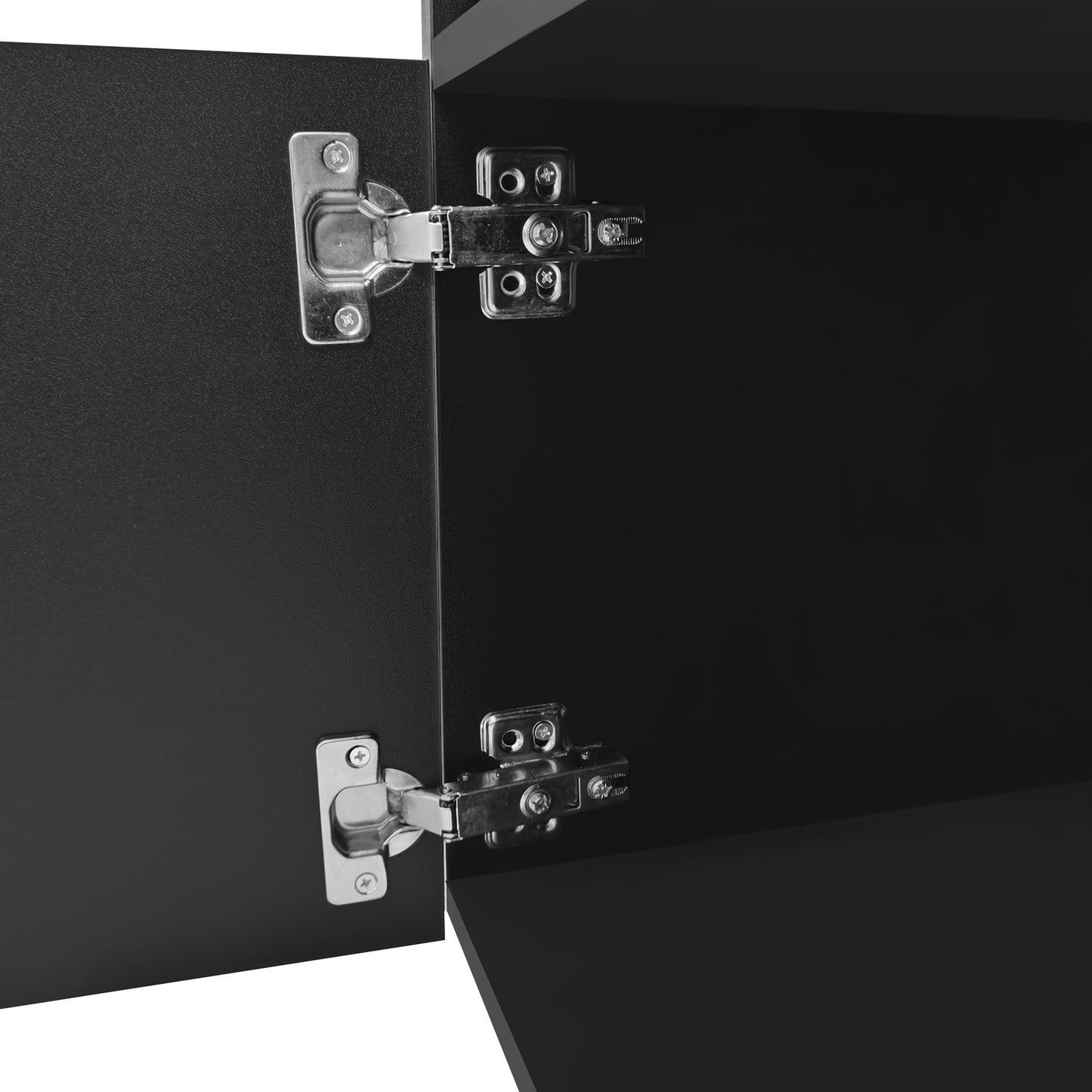 Closeup of brushed nickel cabinet hinges on a matte black cabinet door for modern kitchen hardware
