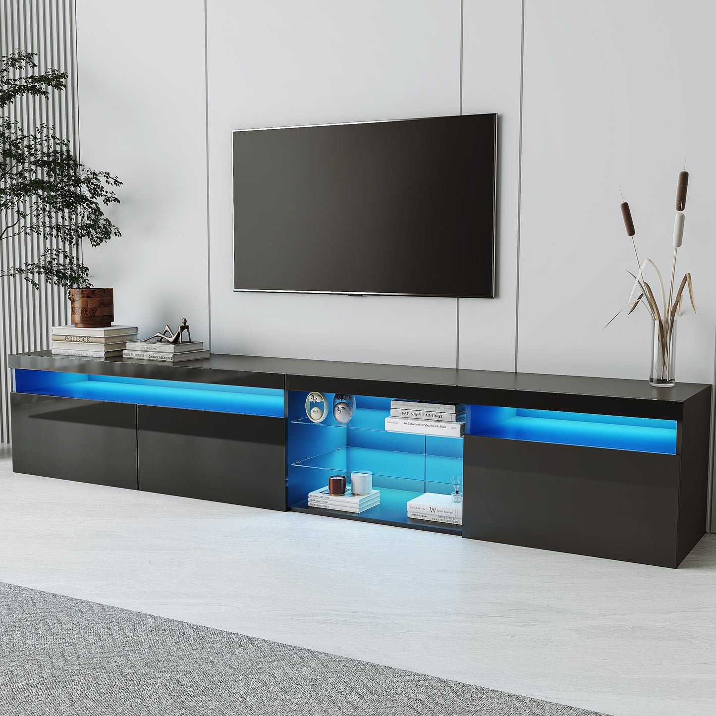 Sleek black media console with blue LED lighting featuring open shelving for media devices