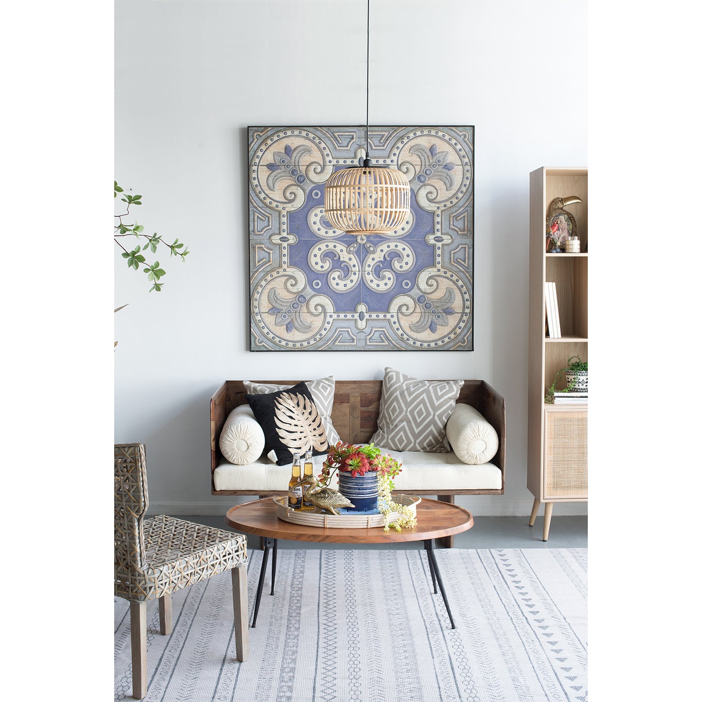 Woven rattan accent chair with wooden legs perfect for a bohemian living room setup