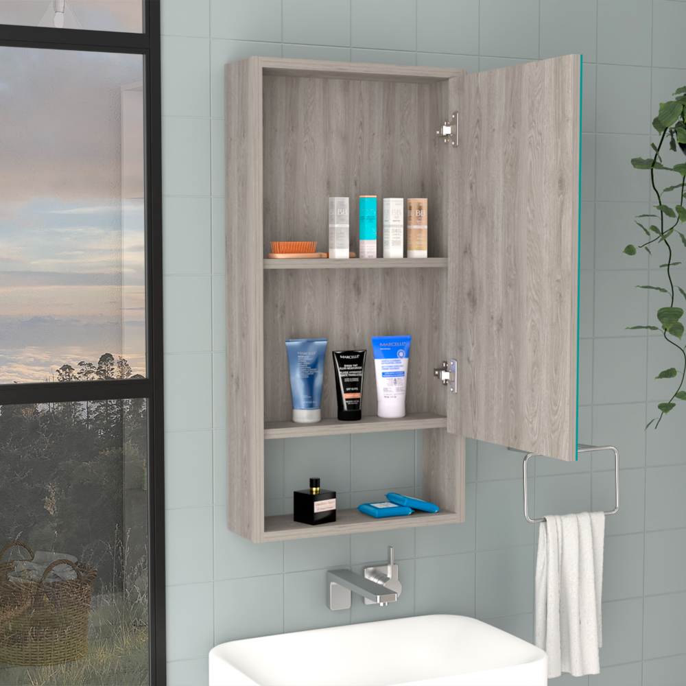 Grey wood medicine cabinet with toiletries and open door