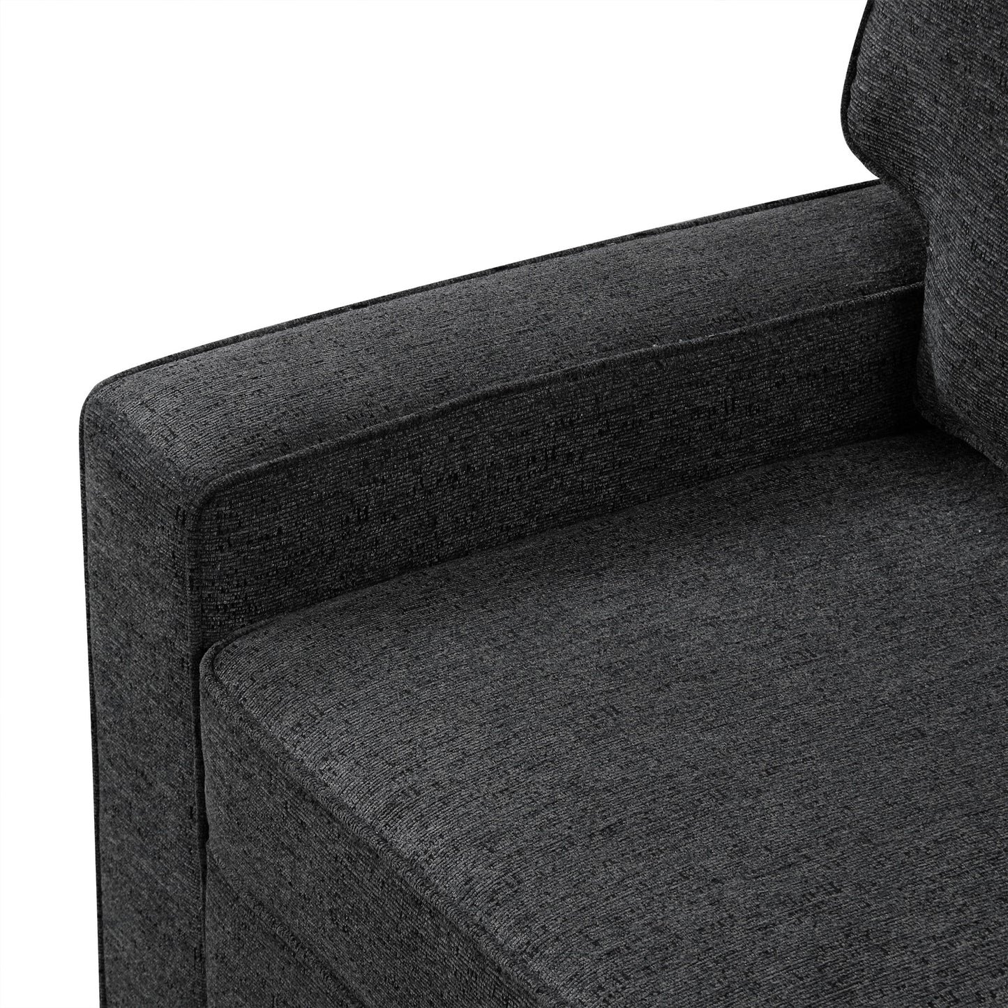 Closeup of a charcoal grey fabric sofa armrest showing textured upholstery detail