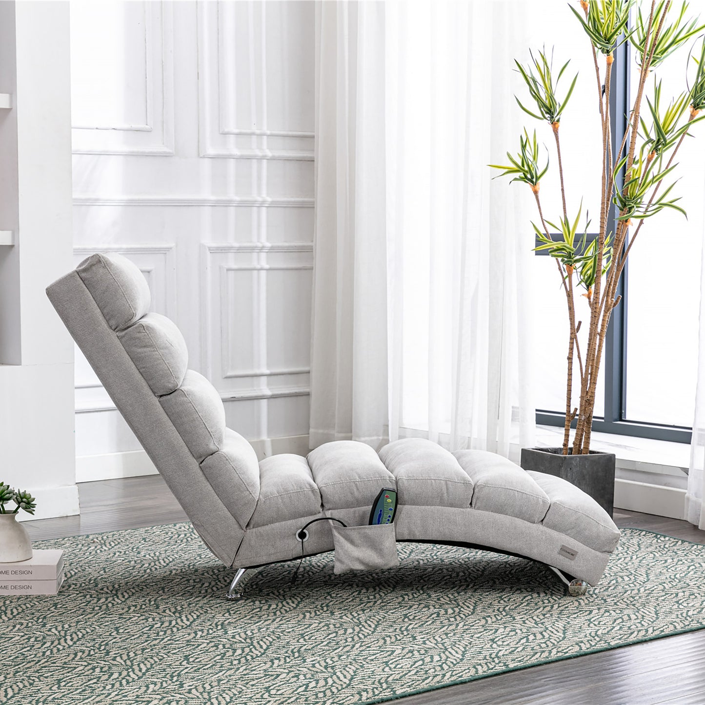 Gray fabric chaise lounge with tufted cushioning and recliner controls