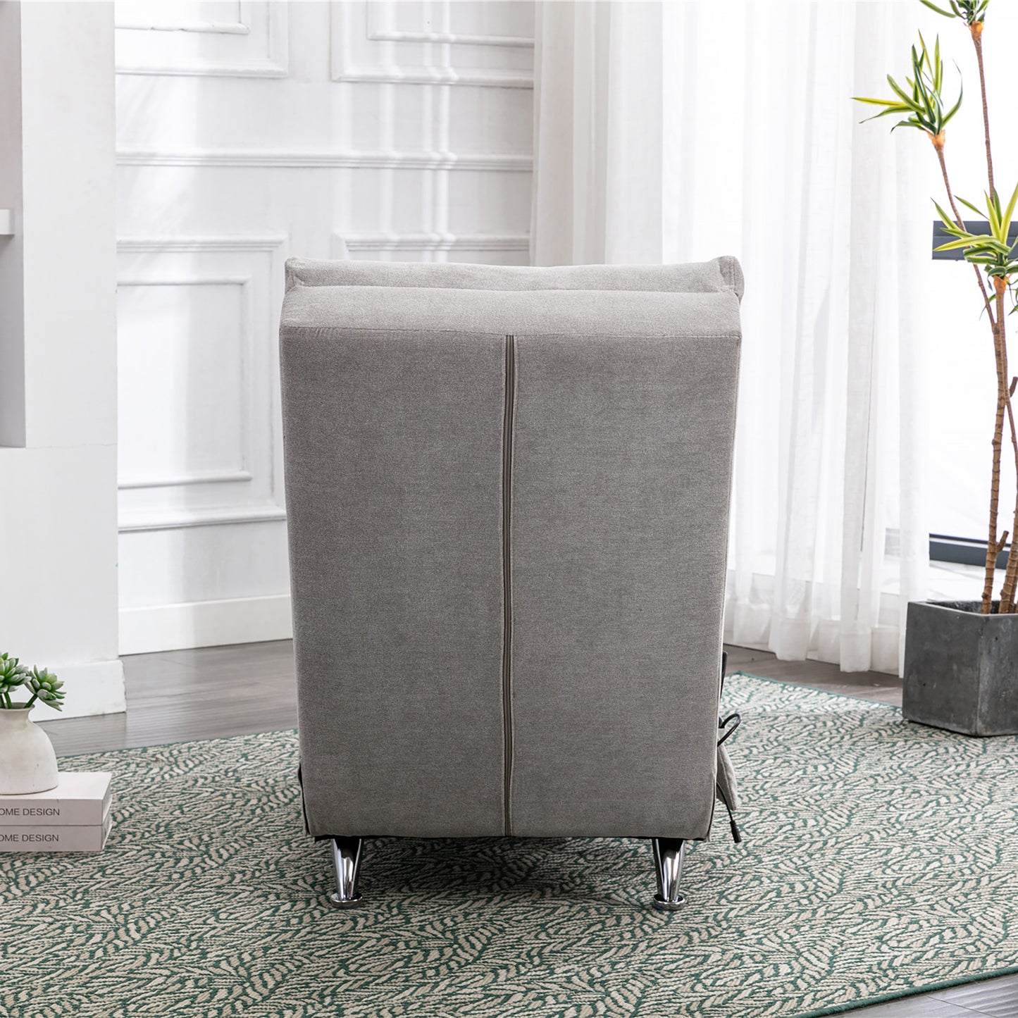 Gray fabric armchair with modern design and chrome legs perfect for living room decor
