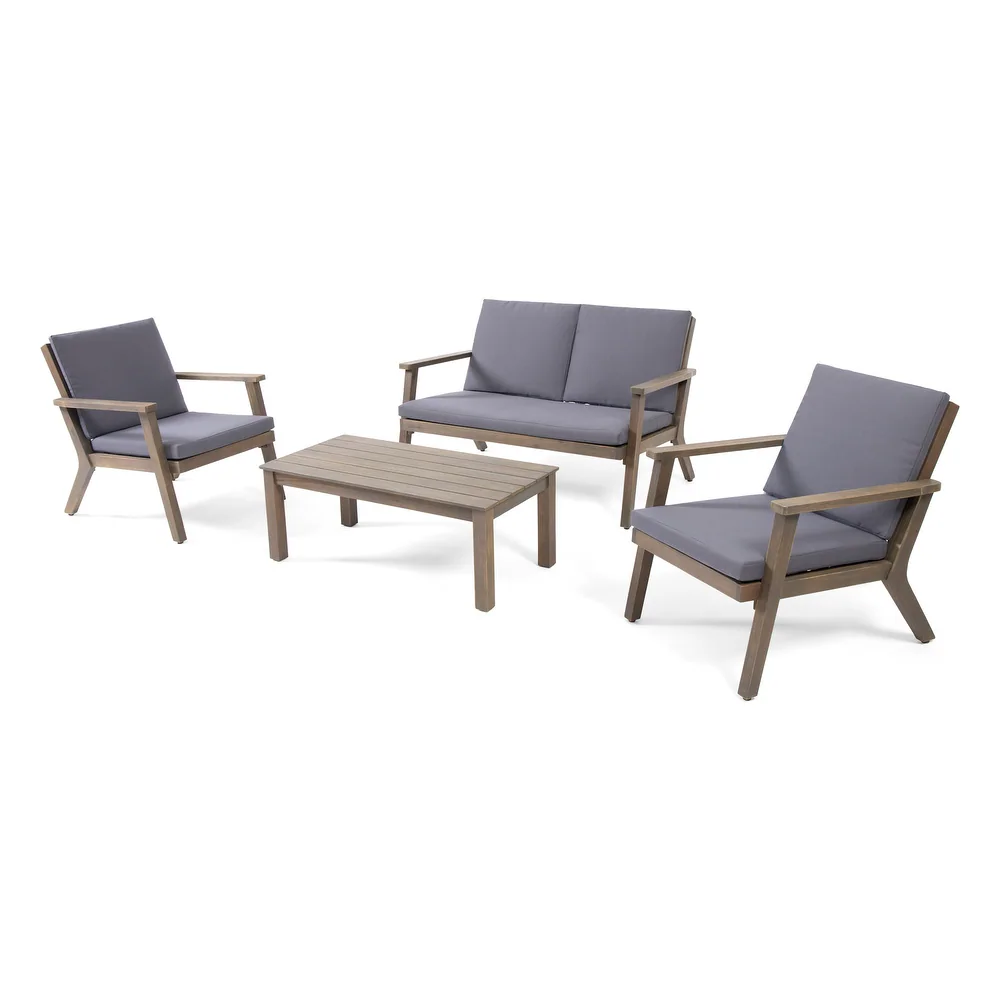 Gray cushioned wood outdoor furniture set with loveseat chairs and coffee table