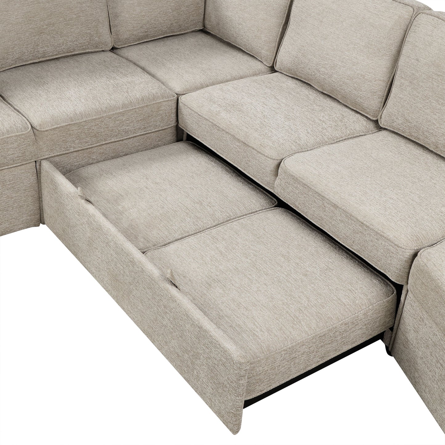 Beige sectional sofa with pullout bed feature and storage drawer visible