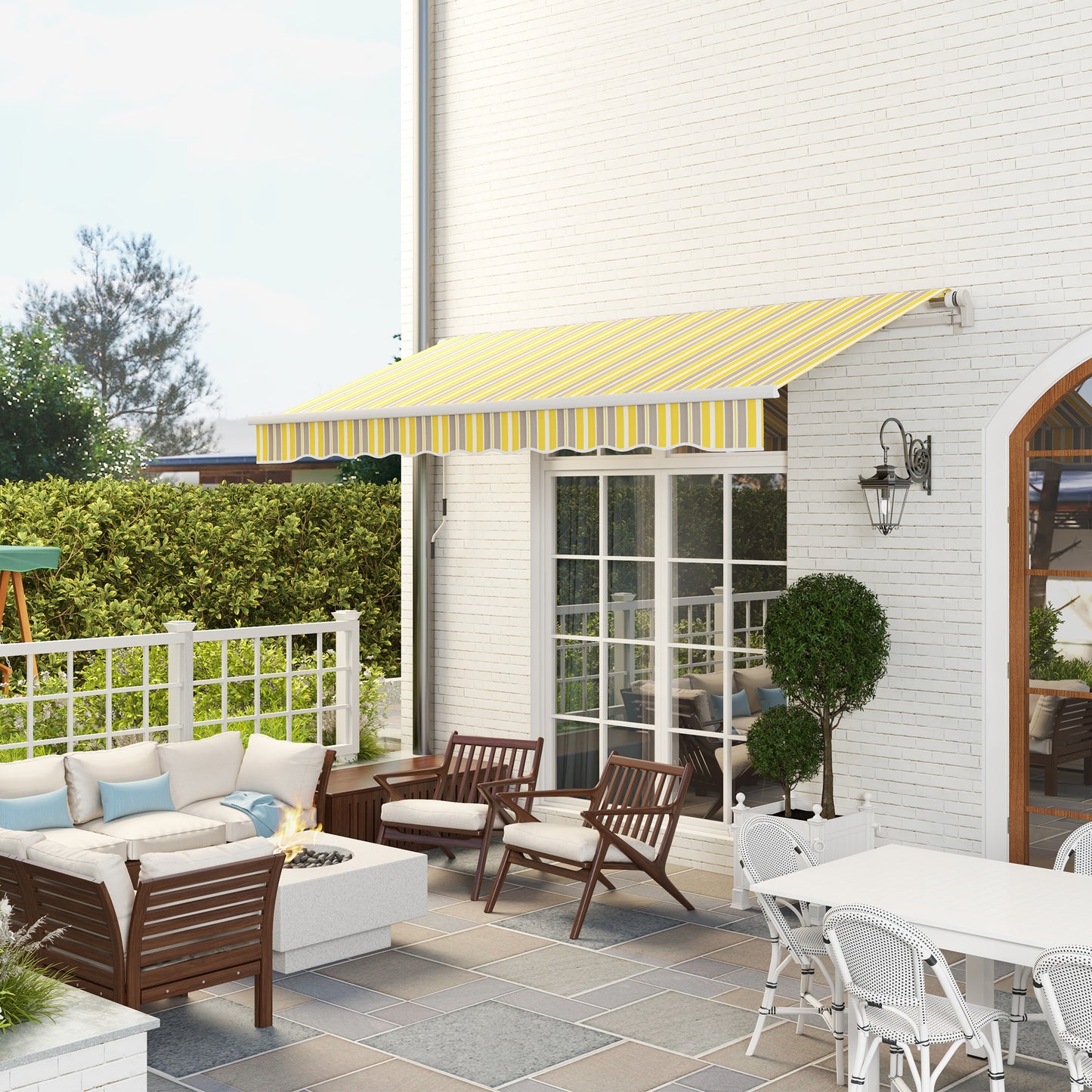 Retractable patio awning with yellow and grey stripes ideal for sun protection