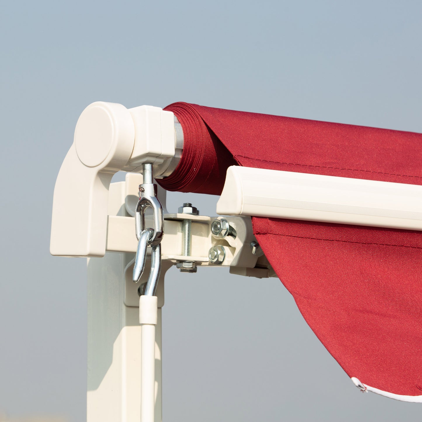 Crimson outdoor awning fabric with white retractable arm mechanism