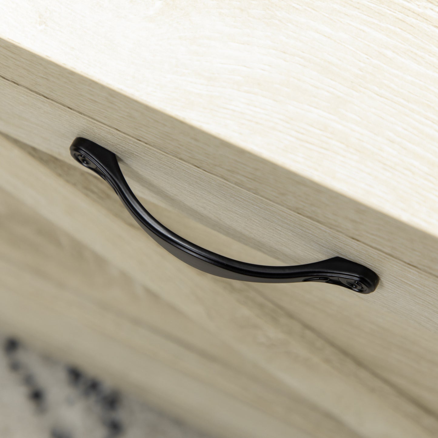 Black curved drawer pull on light wood textured surface modern furniture hardware