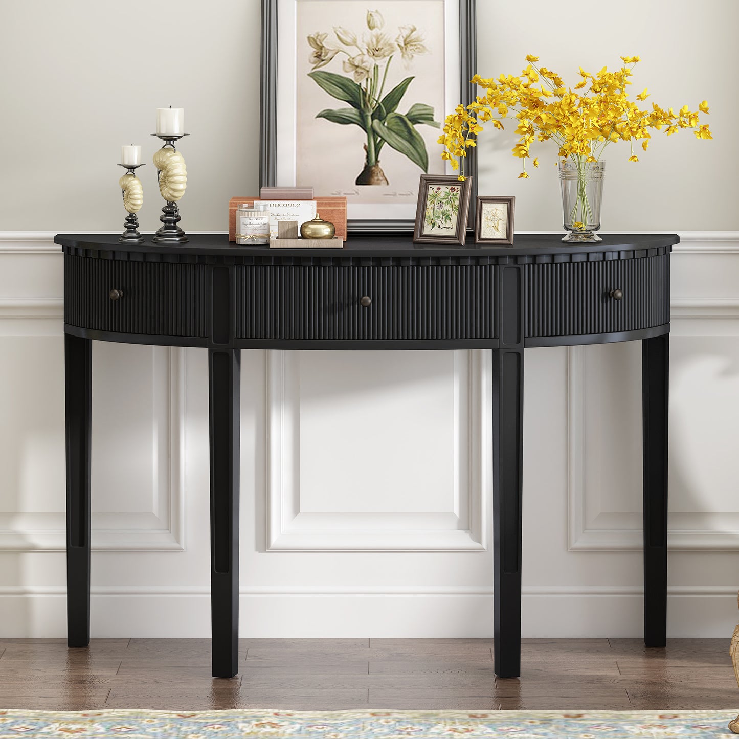 Black fluted console table with three drawers and antique brass knobs