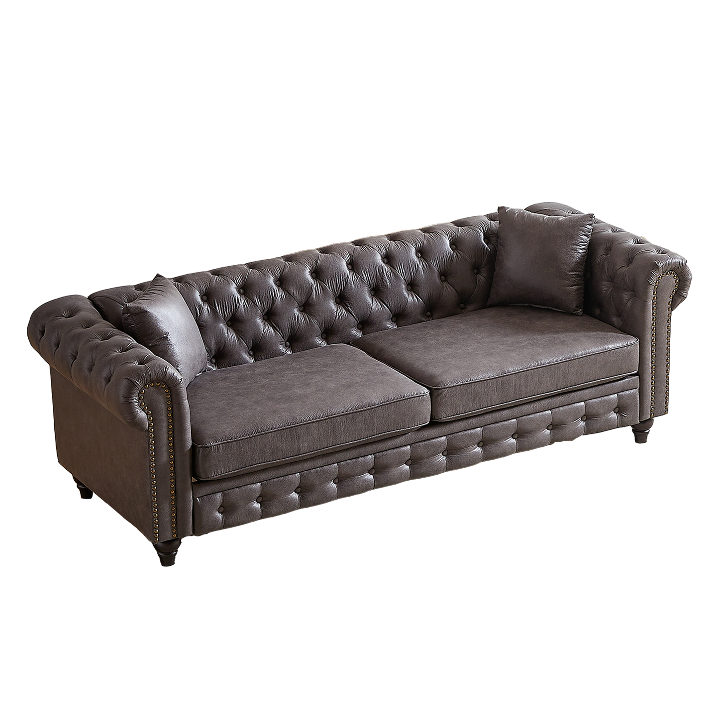 Dark grey tufted leather chesterfield sofa with nailhead trim and included accent pillows perfect for a living room