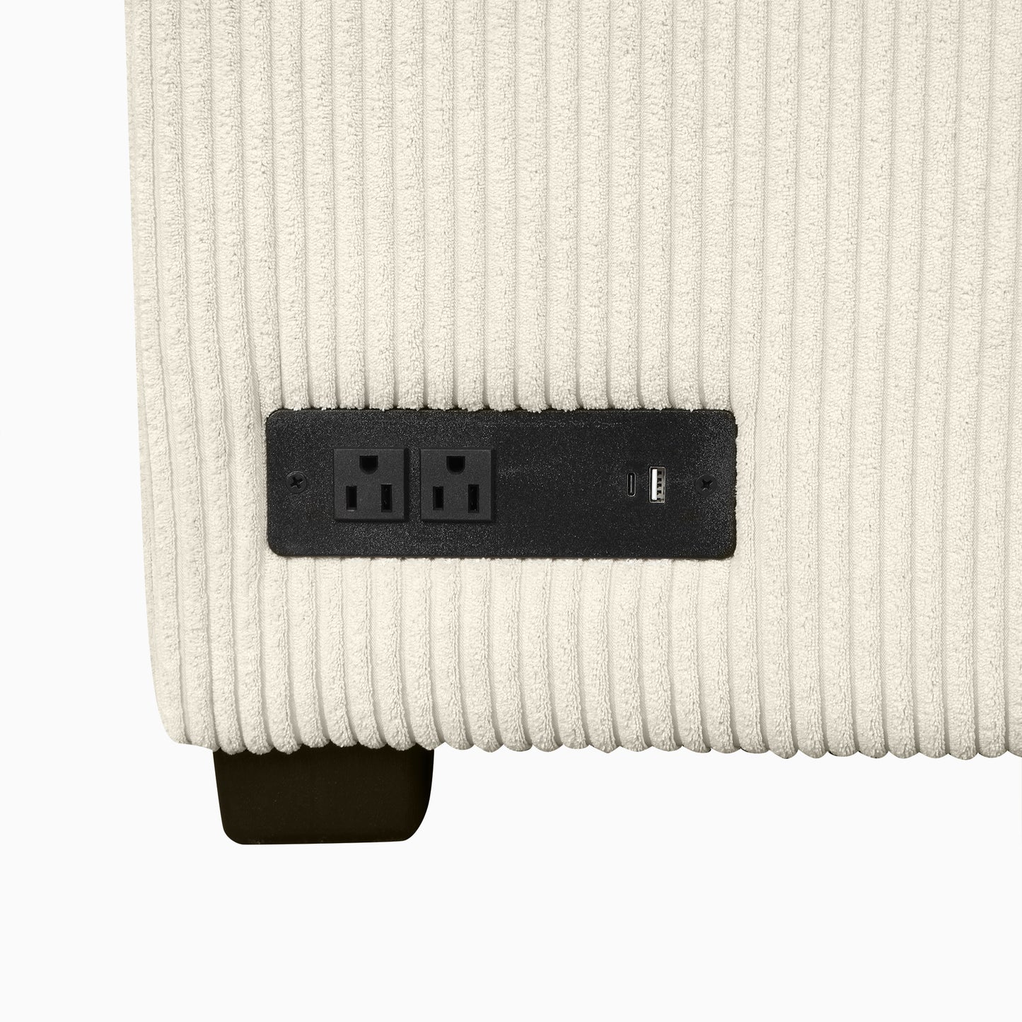 Cream corduroy sofa side with integrated power outlet and USB charger