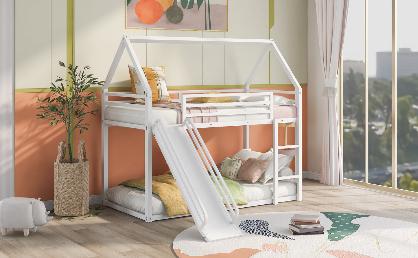 White metal houseframe bunk bed with slide and colorful pillows