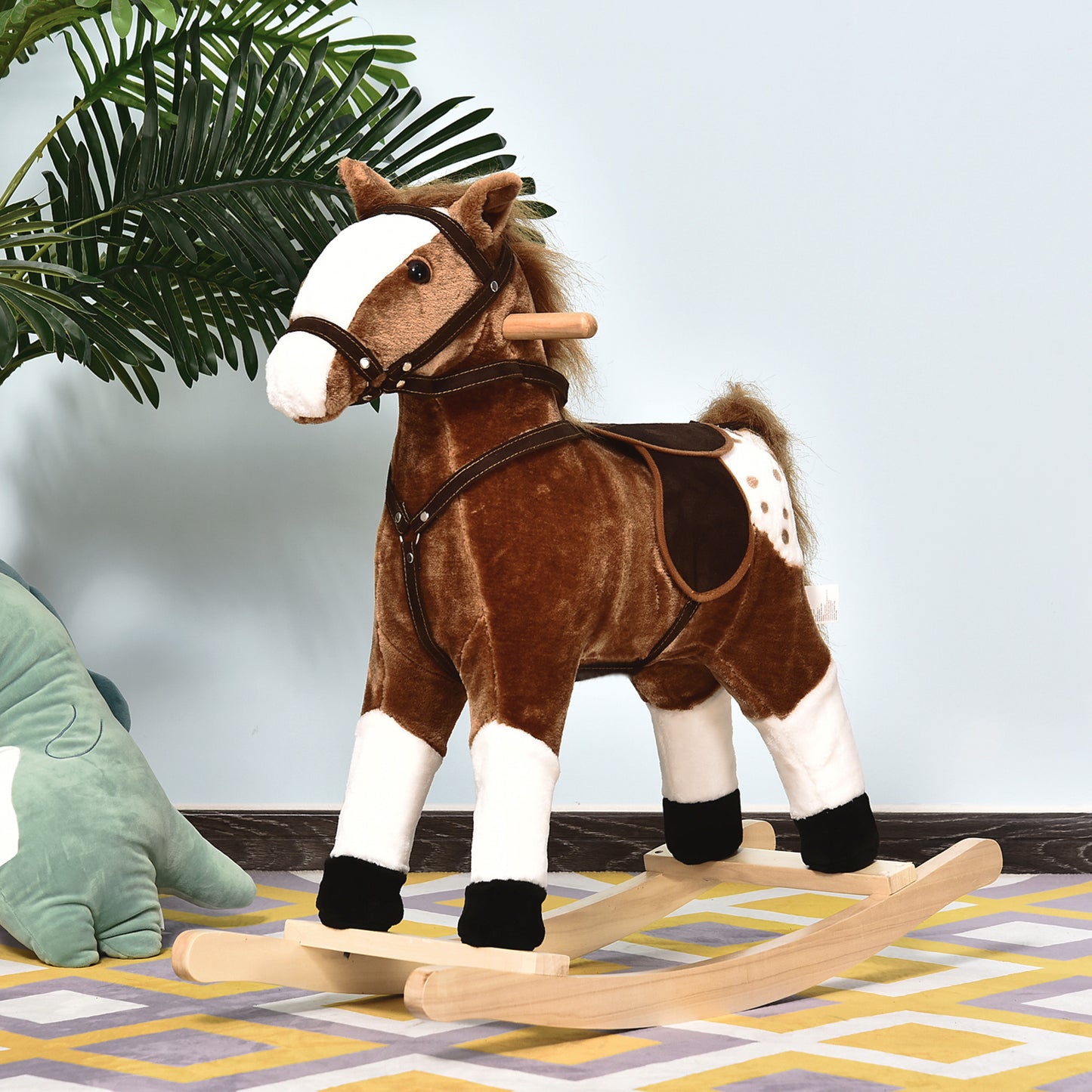 Brown plush rocking horse with white legs and spotted flank on wooden rockers