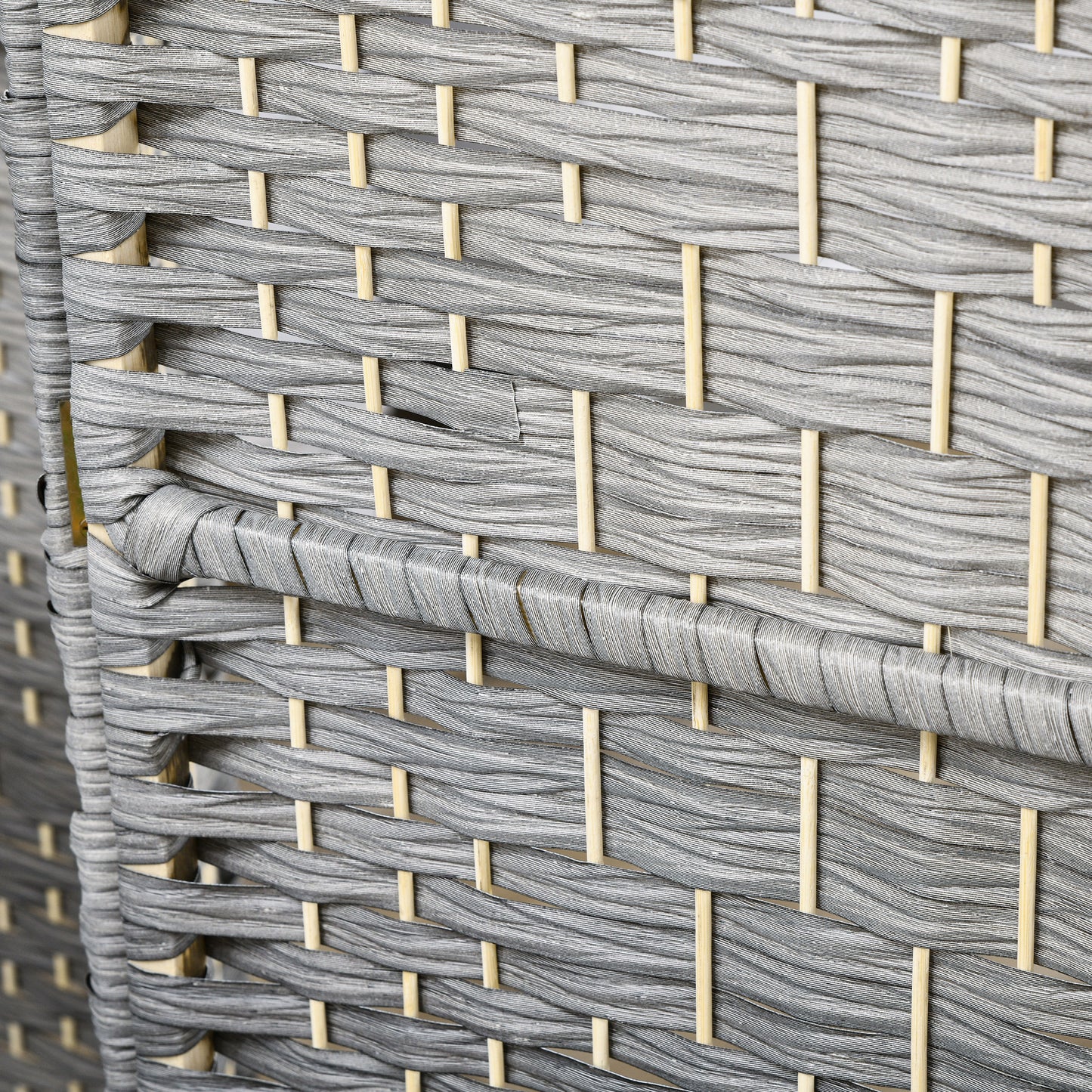 Closeup of grey woven outdoor furniture fabric with a textured weave pattern