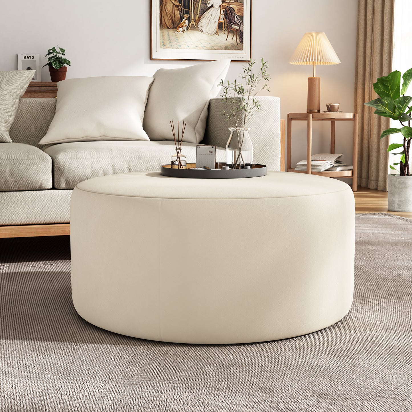 Cream fabric ottoman plush and round perfect for living room seating or coffee table use
