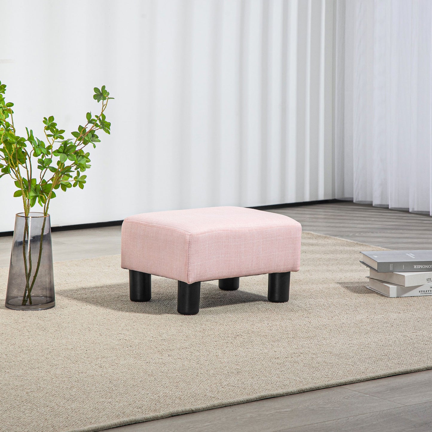 Pink linen footstool with black legs perfect as a stylish accent furniture