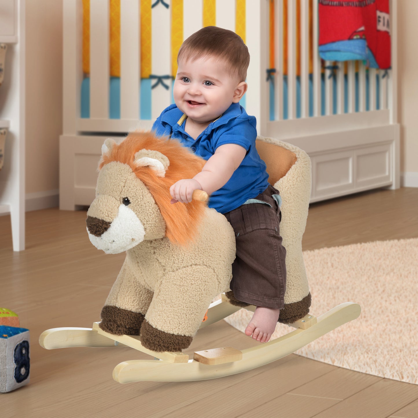 Happy baby boy riding a plush lion rocking horse with wooden base
