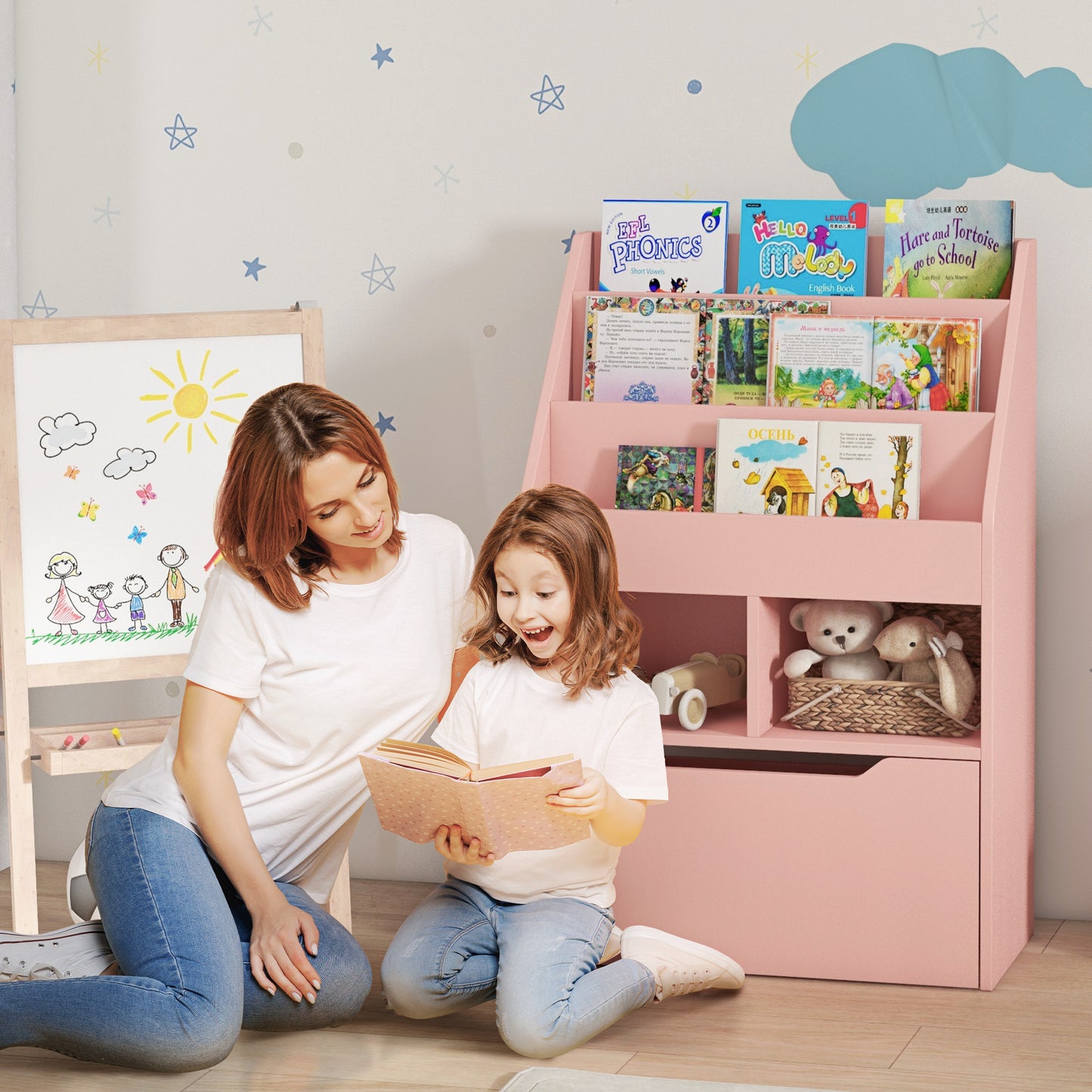 Pink childrens bookshelf with compartments holding plush toys and books