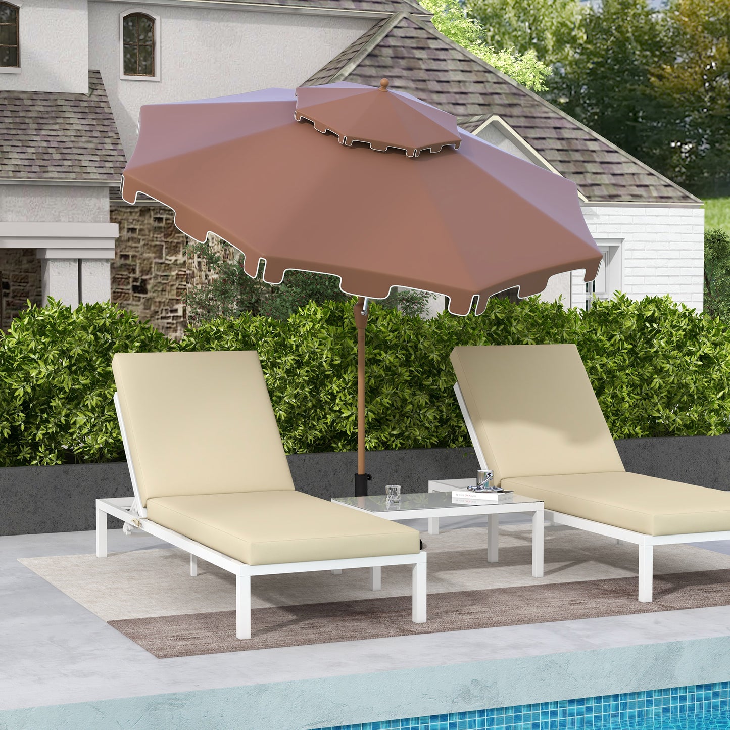 Brown patio umbrella with scalloped edge and two beige chaise lounges by pool