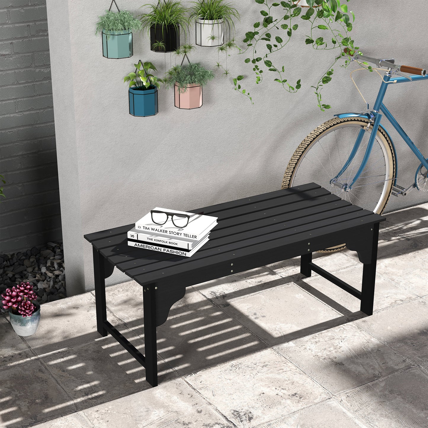 Black slatted outdoor bench with decorative legs perfect for garden patios