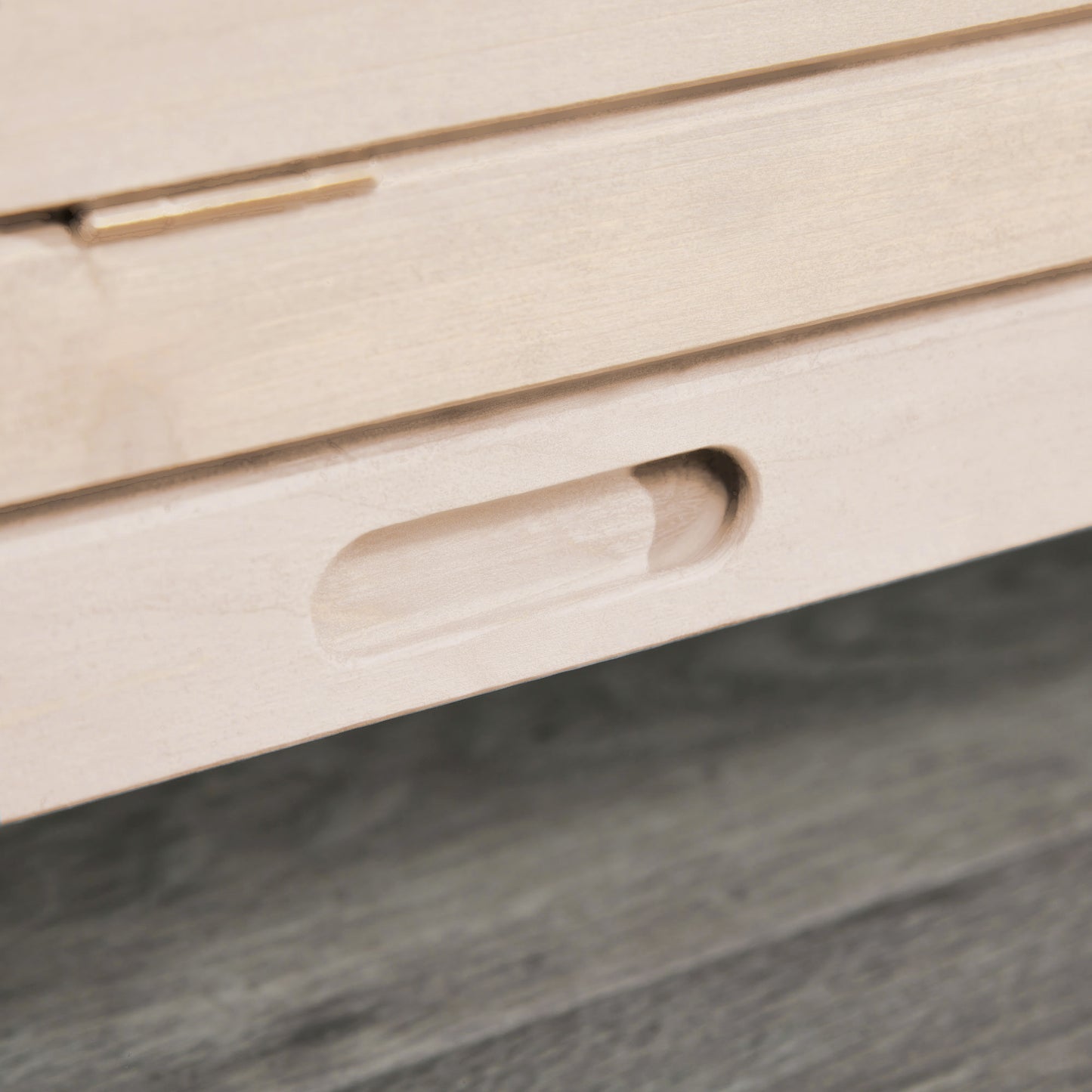 Light wood drawer detail with integrated handle natural finish