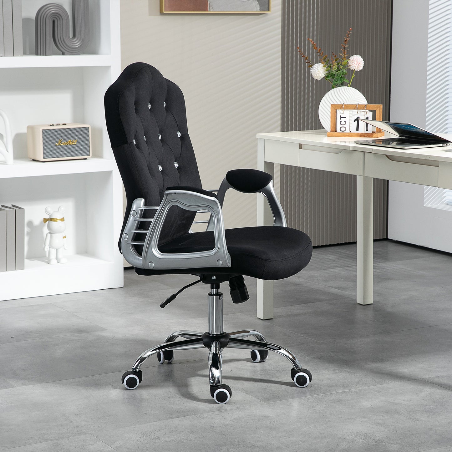 Black tufted velvet office chair with silver accents and adjustable height