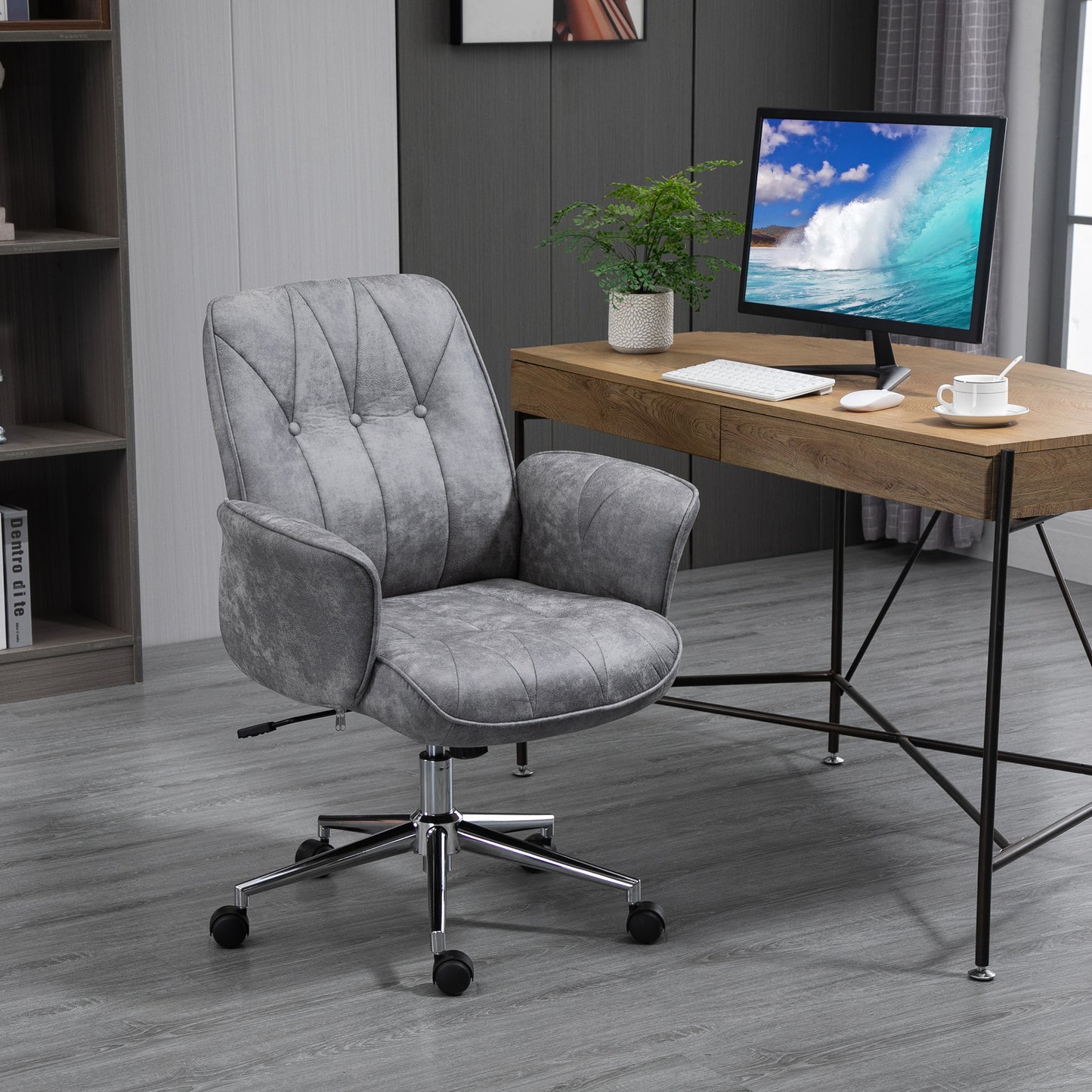 Grey tufted velvet office chair with silver base and wheels