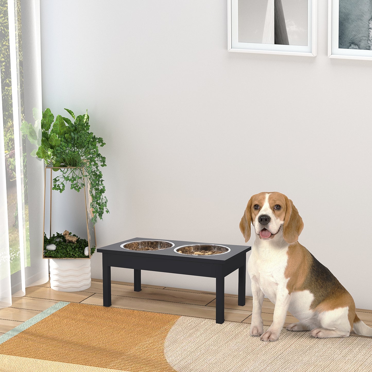 Black wooden raised dog feeder with two stainless steel bowls filled with kibble