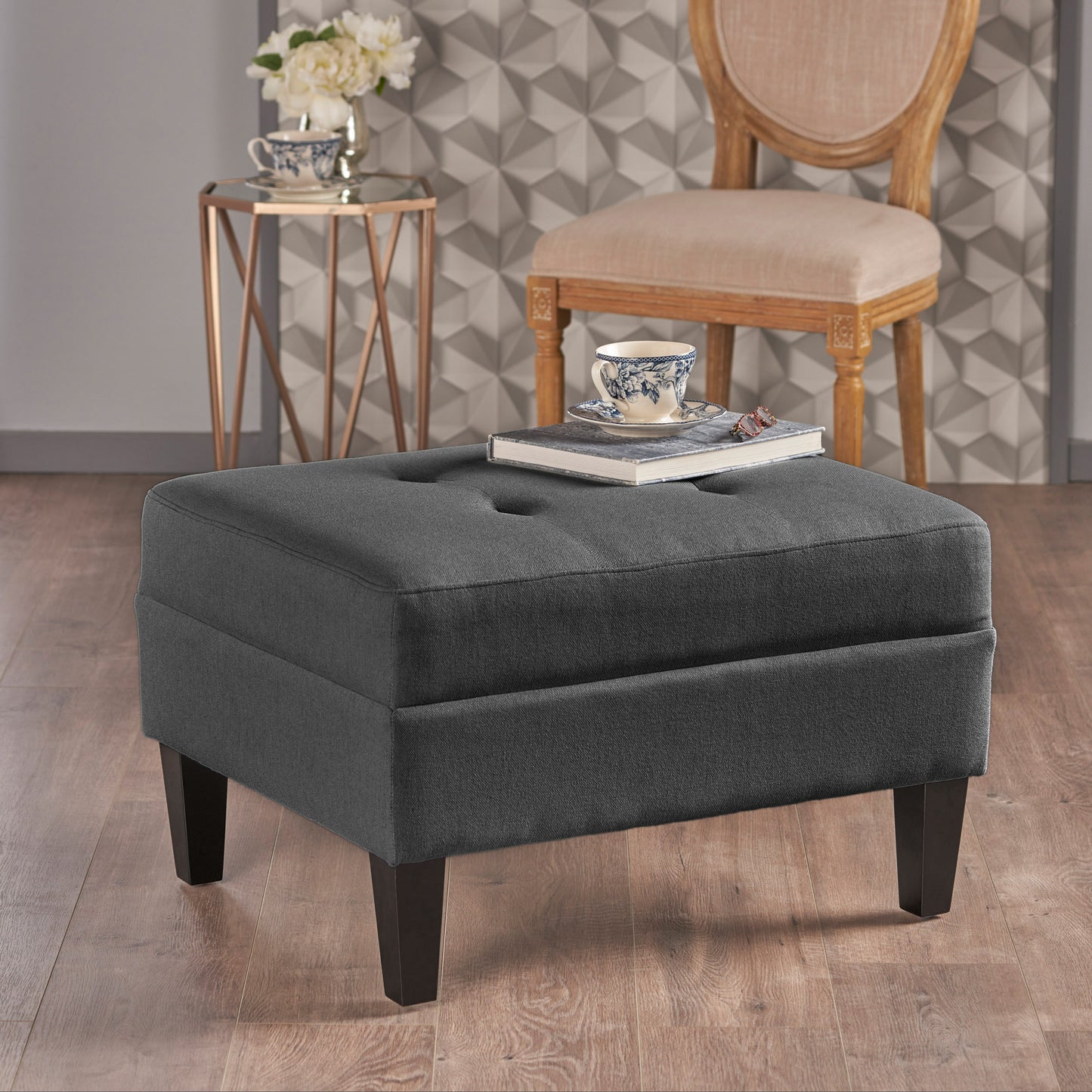 Dark grey tufted fabric ottoman with dark wood legs a stylish addition to any living space
