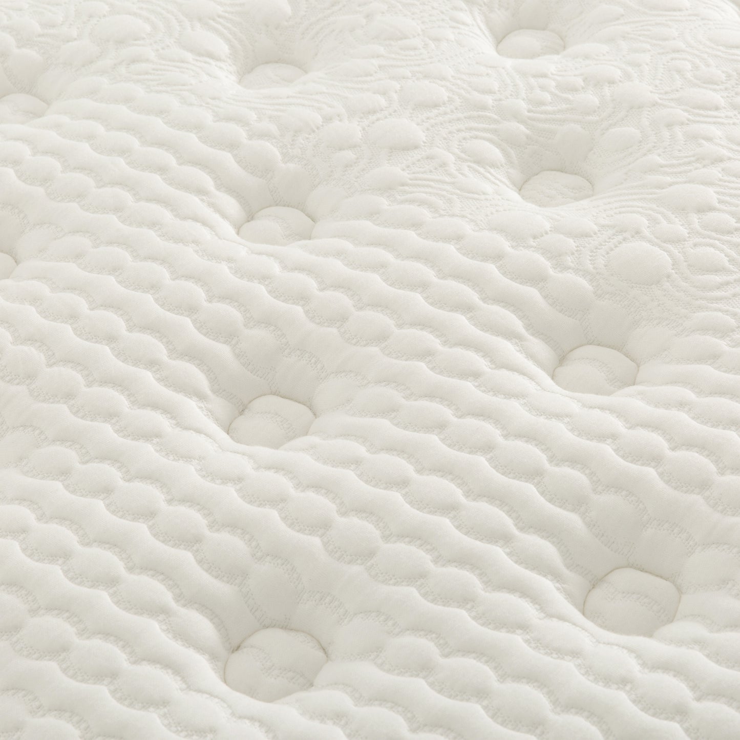 Closeup of quilted white mattress fabric with dimpled pattern for comfort