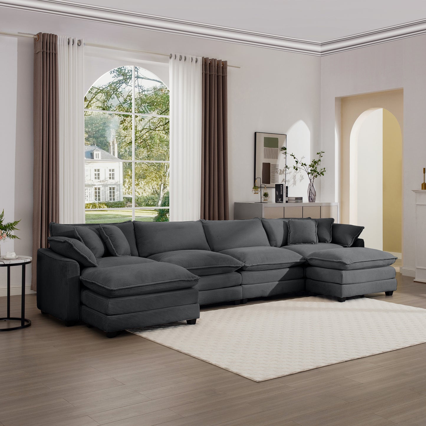 Deep charcoal corduroy sectional sofa with plush cushions offering ample seating for a modern living room
