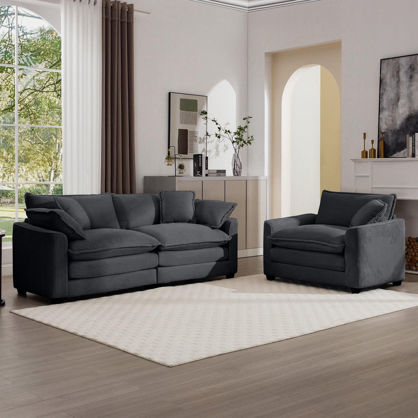 Dark charcoal corduroy sofa with plush cushions and accent pillows