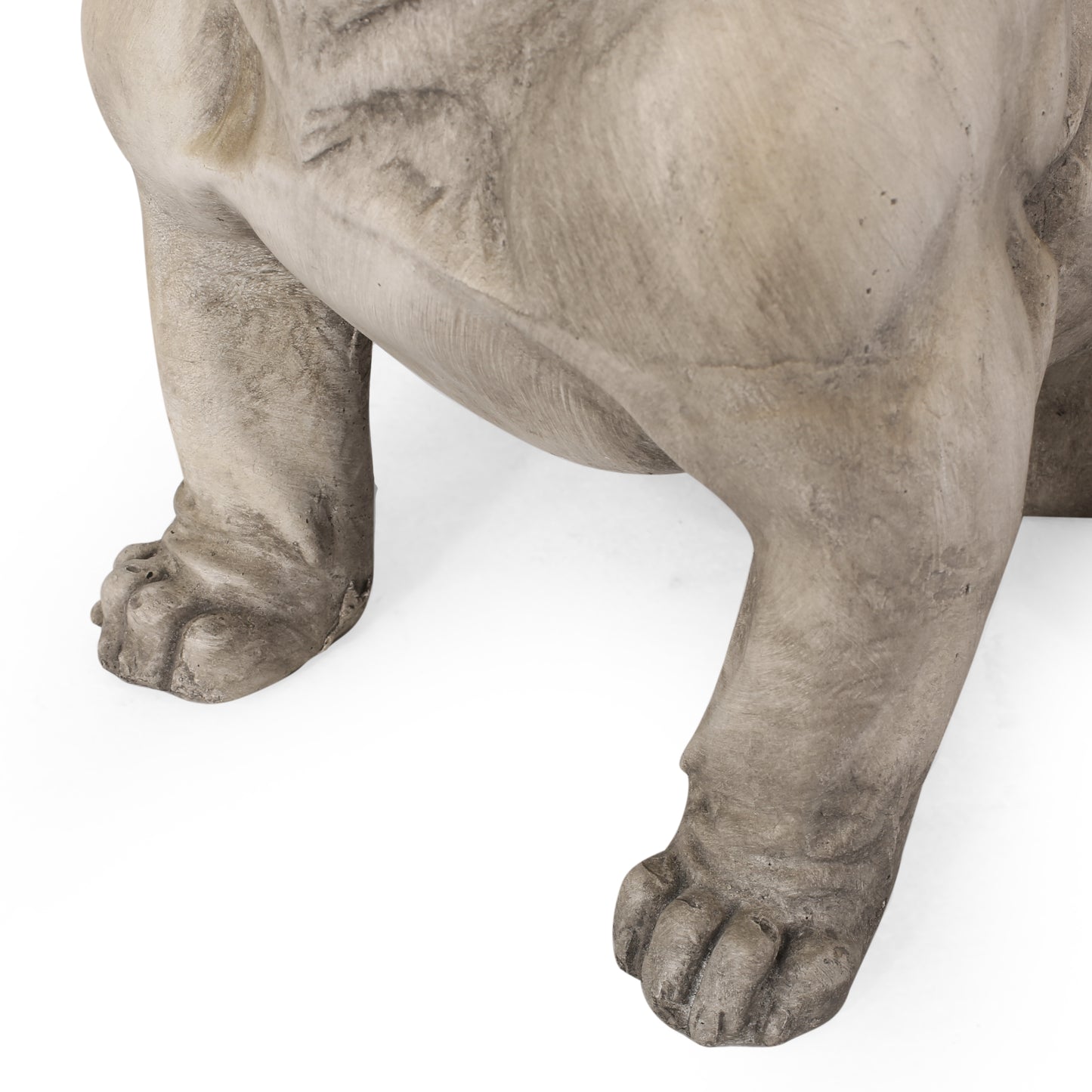 Gray concrete bulldog statue front paws and legs on white background