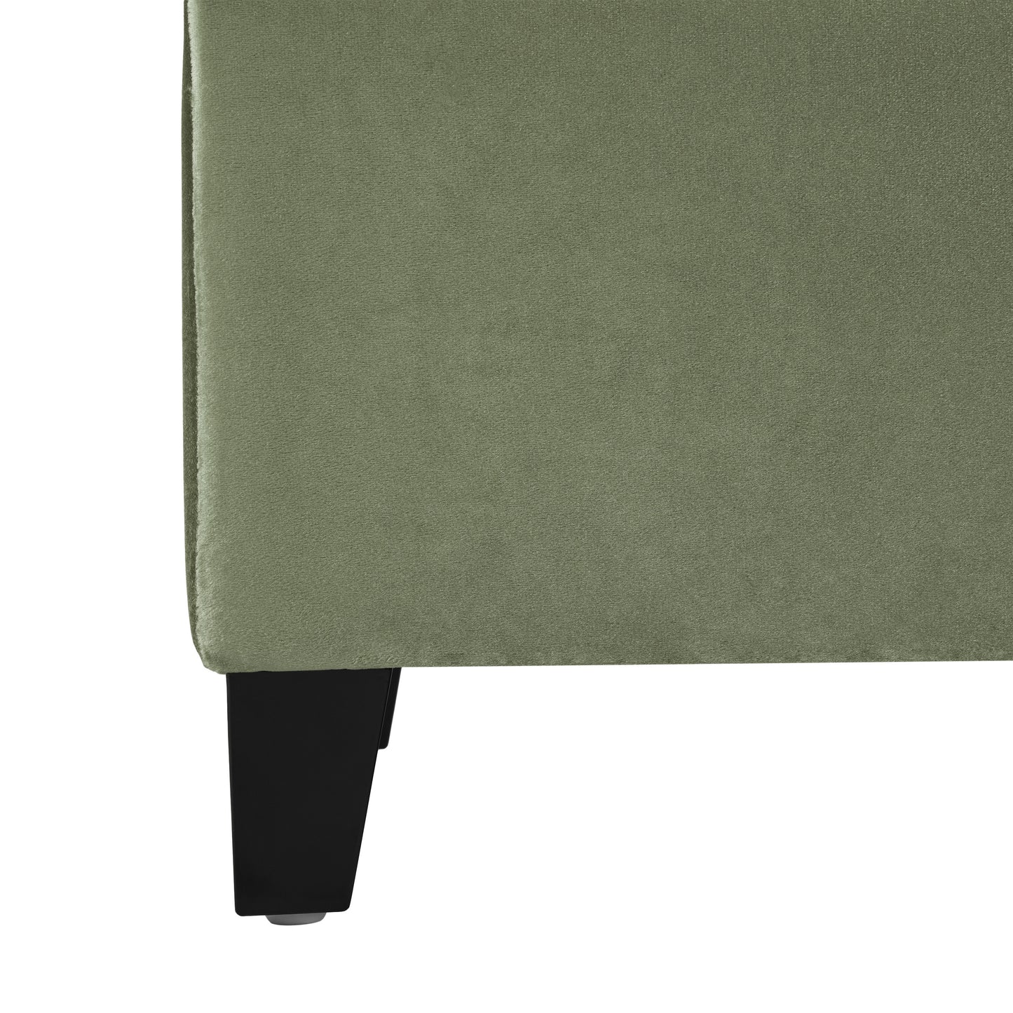 Sage green velvet armchair with black wooden leg detail