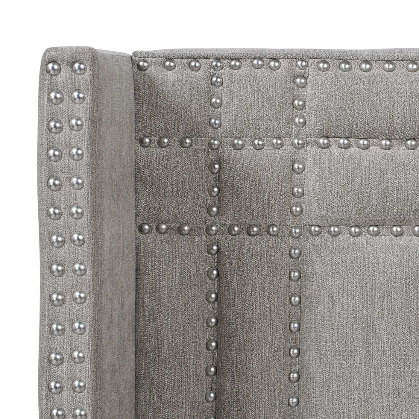 Grey fabric wingback chair headboard with silver nailhead trim detail