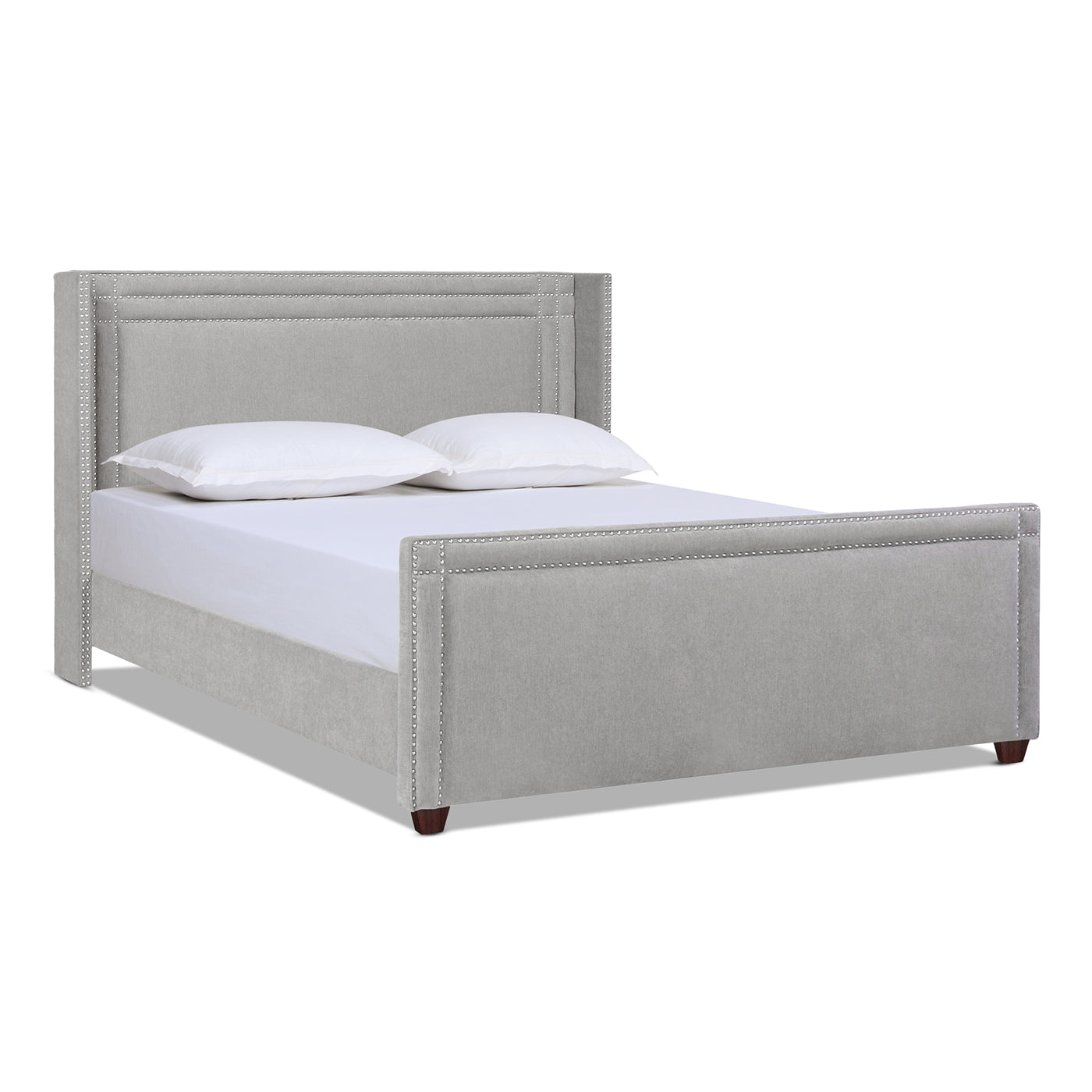 Light grey upholstered bed frame with silver nailhead trim and tufted headboard