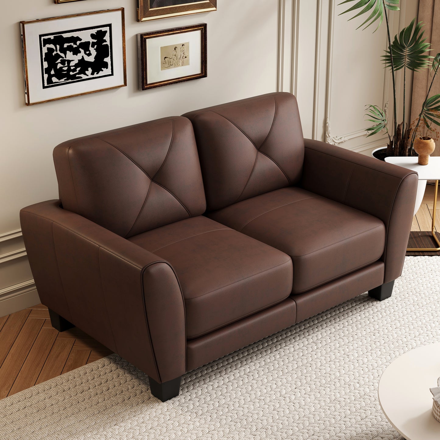 Brown leather loveseat with diamond tufting and black wooden legs